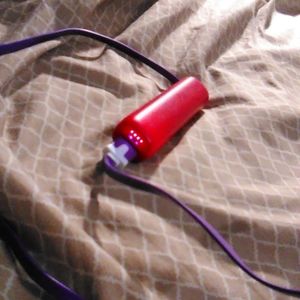 Portable battery charger with a cord that doesn't tangle